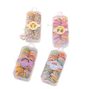 Colorful elastic kids hair ties, small rubber bands in clear boxes for cute girls daily hair styling.