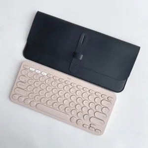 Detail view of black PU leather keyboard protective sleeve case paired with portable wireless keyboard.