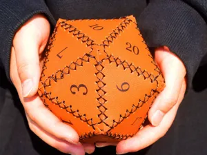 Orange leather D20 dice bag for tabletop roleplaying games, durable PU storage pouch.