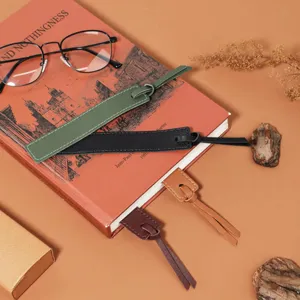 Detail view of multi-color leather bookmarks with tassels, highlighting texture and reading setup.