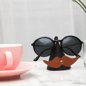 Detailed close-up of the creative mustache leather glasses stand, showing fine craftsmanship.
