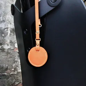 Portable PU leather key ring holder strap protector cover for car keys and luggage tags daily use.