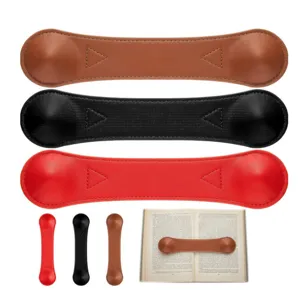 Weighted leather book page holder bookmark set in brown, black and red colors for reading.