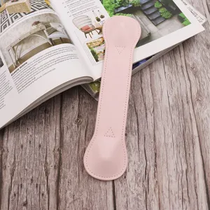 Pink leather weighted bookmark for reading, stylish page holder and book weight.