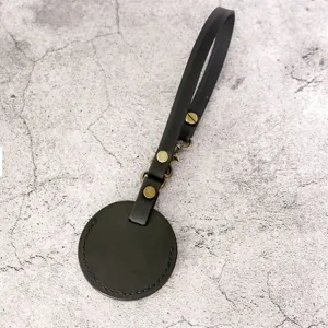 PU leather key holder loop case with strap and metal hardware for smart tracker or keys.
