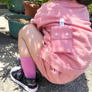 Pink leather baby pacifier pouch cute amulet storage bag with clip for infants daily use.