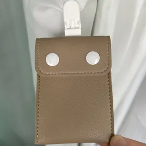 Portable baby pacifier storage bag with clip and snaps, ideal for stroller hanging.
