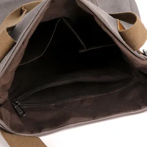 Grey canvas tote bag interior view, large capacity casual shoulder handbag with zip pocket.