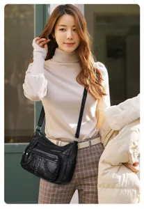 Soft leather multi-pocket crossbody bag for women, casual single shoulder bag detail view.
