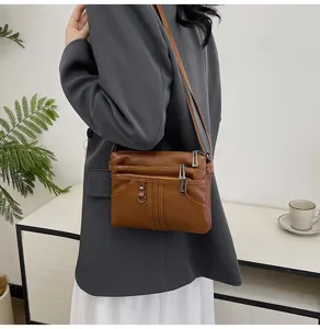Washed soft leather crossbody bag for women, multi-zipper small shoulder bag, brown.
