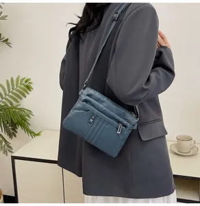 Washed soft leather crossbody bag for women, stylish multi-pocket casual shoulder handbag.