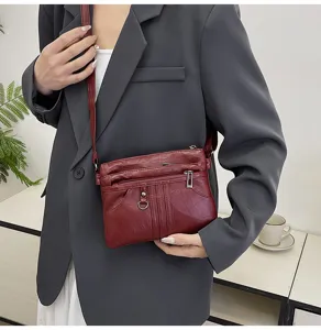 Soft leather crossbody bag for women, multi-pocket small shoulder bag with adjustable strap.