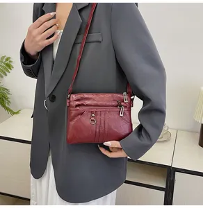 Washed soft leather crossbody bag for women, multi-zipper casual shoulder phone purse.