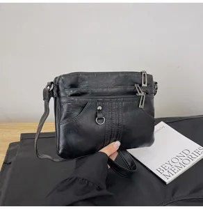 Black washed soft leather cross-body bag, casual multi-pocket design, perfect for daily wear.