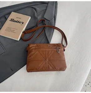 Brown soft leather crossbody bag with geometric stitching, versatile small shoulder bag for women.