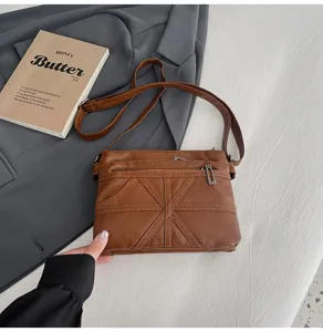 Washed soft leather crossbody bag for women, stylish multi-pocket shoulder messenger bag.