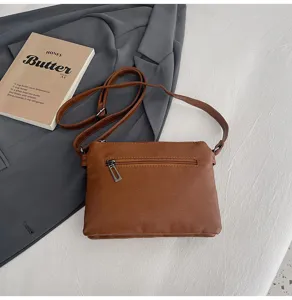Washed soft leather crossbody bag for women, stylish phone purse with adjustable strap.