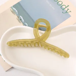 Large acrylic hair claw clip in vintage Morandi green, cross design detail view for thick hair.