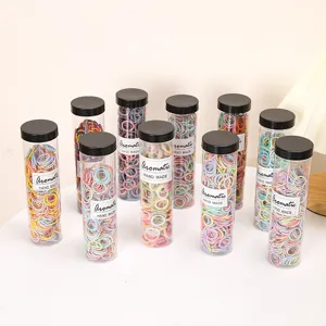 Colorful small hair rubber bands in clear tubes, cute elastic hair ties for kids.