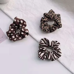 Women's autumn winter fashion fabric hair scrunchies set featuring leopard zebra and dot patterns.
