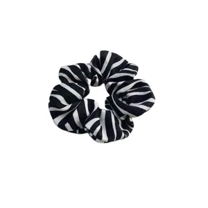 Black and white zebra print fabric hair scrunchie, soft elastic ponytail holder accessory.