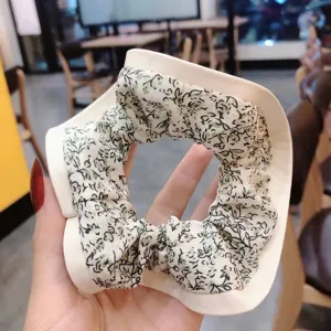 Floral scrunchie with white PU geometric frame, stylish hair tie for women daily casual wear.