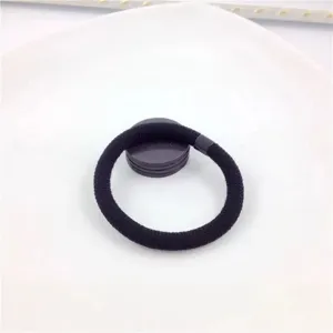 Black elastic hair band detail shot, simple durable nylon hair accessory for daily use.