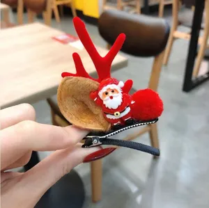 Detalle horquilla de pelo reno Navidad Papá Noel, lindo accesorio de pelo festivo.