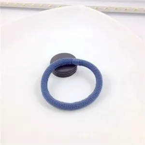 Blue hair tie detail shot, simple elastic hair band for daily hairstyles and ponytails.