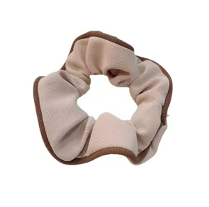 Plain pink fabric hair scrunchie with brown edge for women and girls daily wear main view.