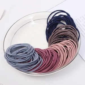 Detail view of colorful high elasticity hair ties, basic hair bands set for daily styling.