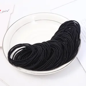 Black elastic hair ties detail view, 2mm thick rubber bands for daily styling and secure hold.