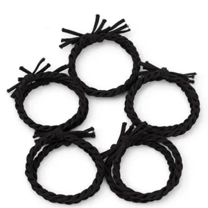 Detailed view of the black braided hair tie showing the handmade knot and thick elastic texture.