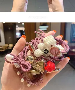 Cute pink hair ties set with pearls and lace bows for women and girls daily styling.