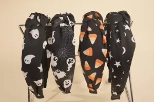 Halloween knotted headband set featuring ghost, spider web, candy, and star prints.