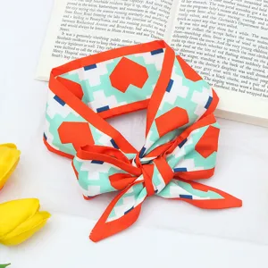 Chic geometric heart print silk hair scarf, elegant orange bordered twilly ribbon detail.