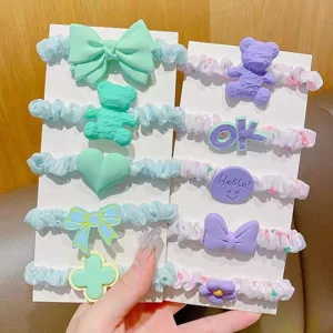 Detailed shot of cute Korean style hair ties set with colorful bows and resin charms.