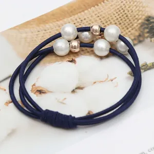 Elegant dark blue hair tie with white artificial pearls and metal beads, durable elastic band.