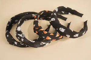Halloween knotted headband set featuring cute ghost spider web prints on black fabric details.