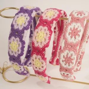 Boho crochet hair hoop detail, handmade knitted floral headband accessory for women.