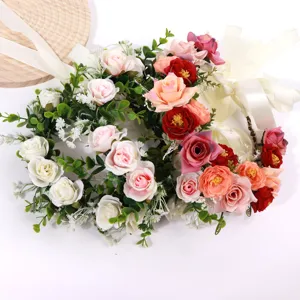 Close-up detail of bohemian floral hair wreath with colorful roses and ribbons for wedding.