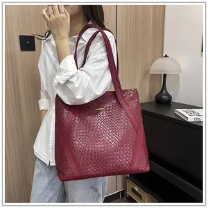 Detailed view of the women's retro woven leather tote bag, showcasing large capacity.