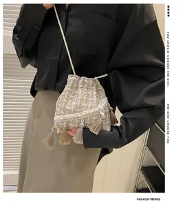 Woven tweed bucket bag for women with chic fringe and rhinestone decor, stylish shoulder bag.