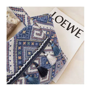 Ethnic style woven tote bag with tassels and geometric patterns for daily commuting and travel.