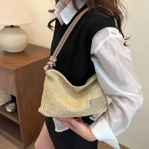 Casual woven shoulder handbag for women, hollow out summer beach tote bag with chic design.
