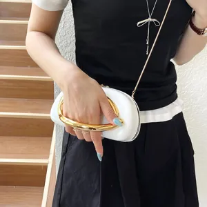 Elegant white shoulder bag with bold gold handle and sleek chain strap for modern women fashion.