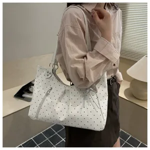 Stylish polka dot shoulder bag for women, large capacity commuter tote bag for daily use.