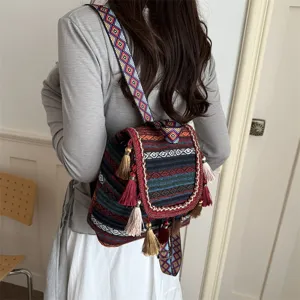 Ethnic style bohemian canvas backpack with colorful geometric straps and cute tassels for women.