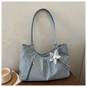 Korean style polka dot shoulder bag with large capacity, front zipper pocket and cute star pendant.