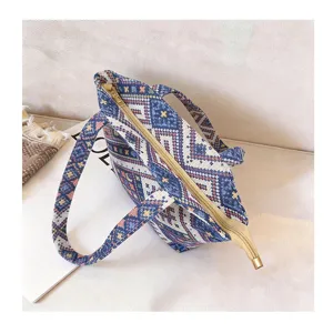 Detailed top view of the ethnic geometric pattern fabric tote bag featuring secure zipper closure.